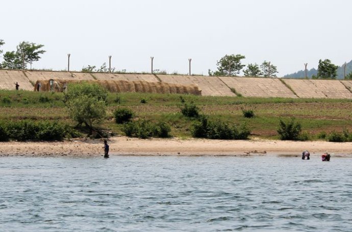 中朝边境美丽的风景,中朝边境桃花盛开的地方