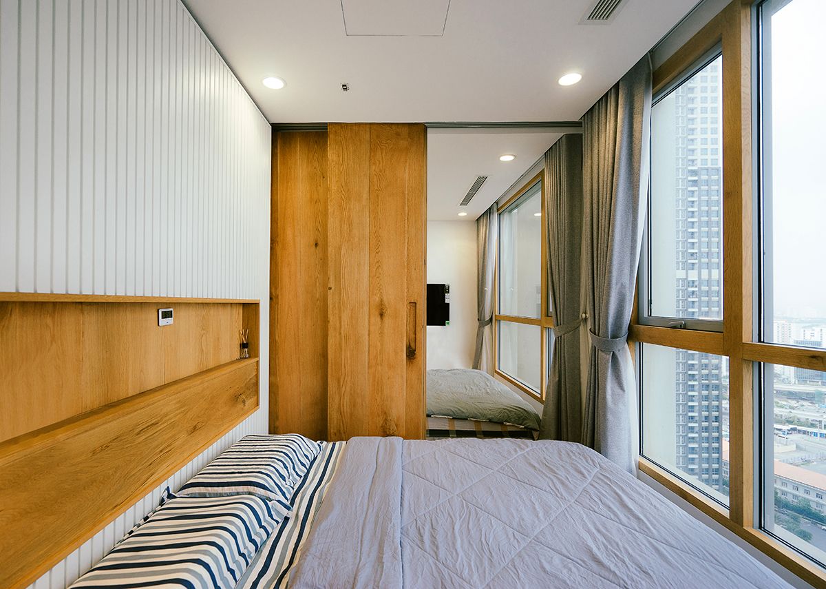 客厅卧室打通隔断折叠推拉门,门挨门相邻两套房打通装修效果图