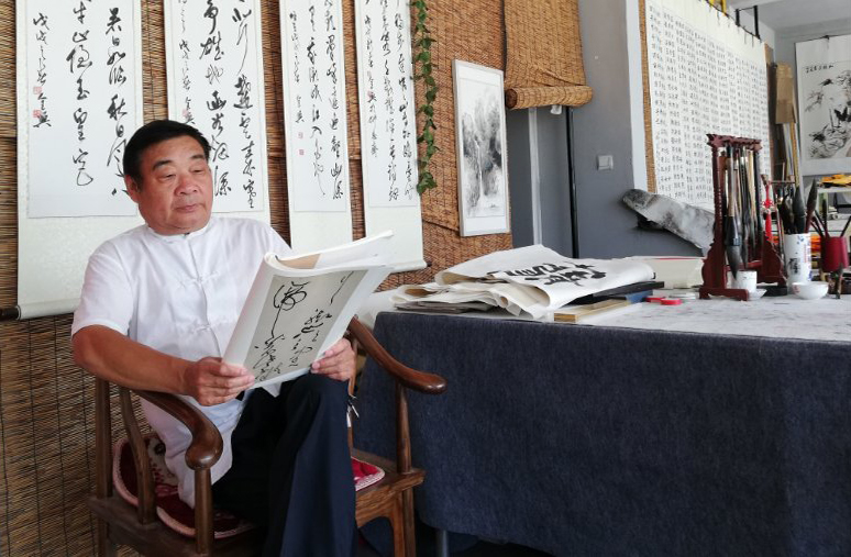 墨韵达贺意红木展丰华