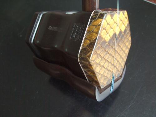 二胡蟒皮塌陷的原因是什么,二胡蟒皮蒙皮有几个步骤