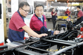 薛兴震：跌宕人生为“唐骏”