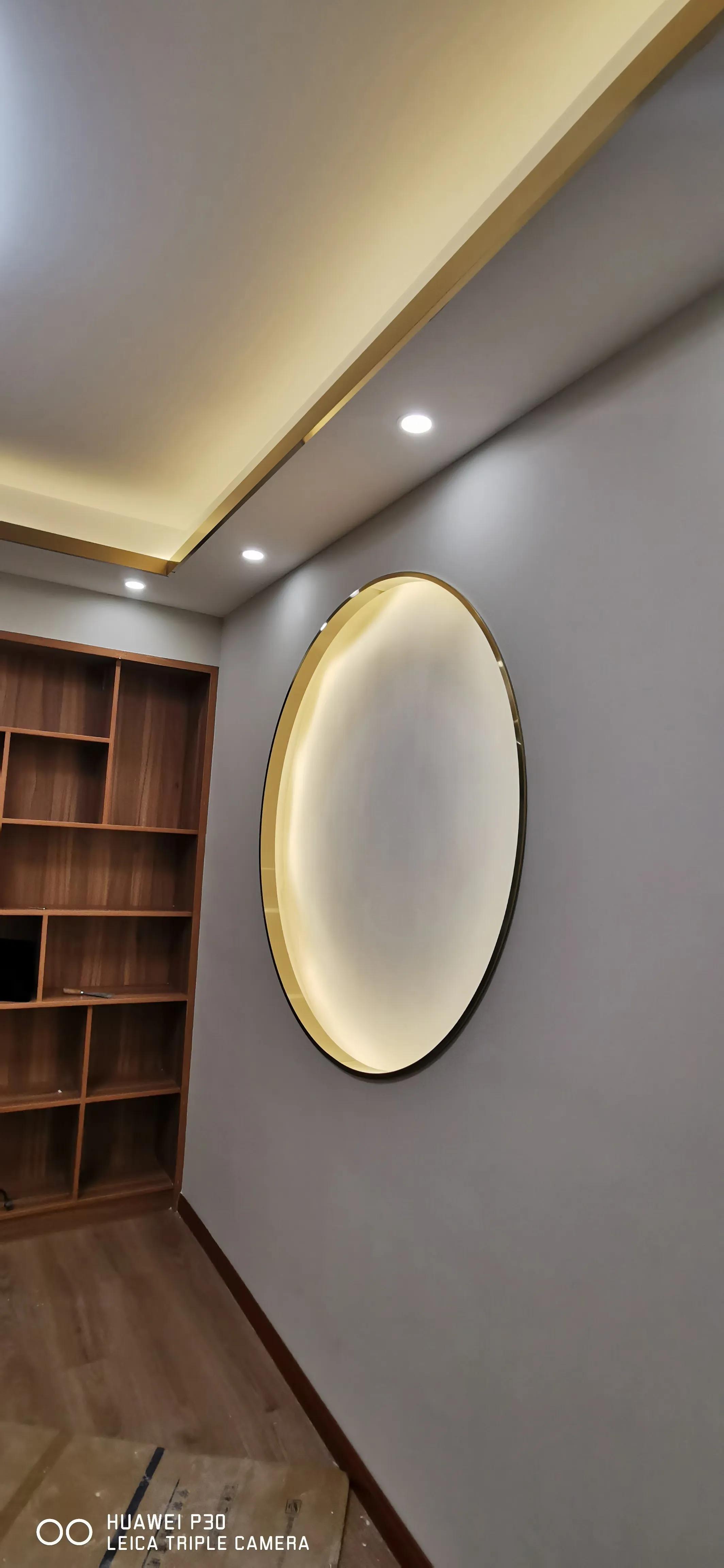 弧形背景墙弧形门套,客厅不锈钢窄边门套造型效果图