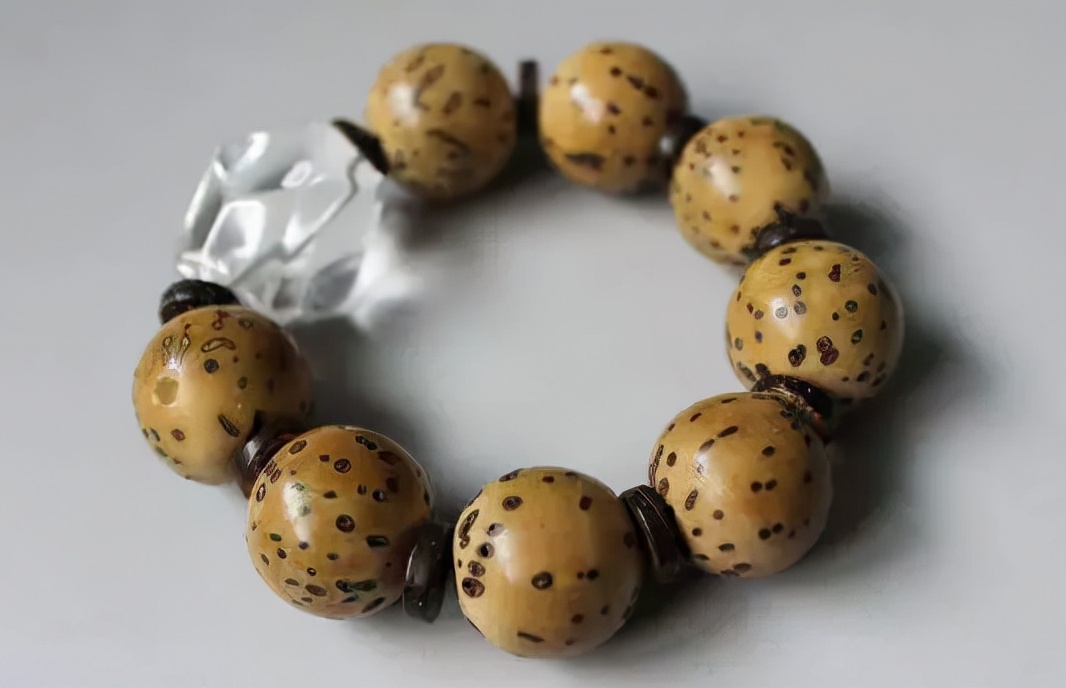 怎么挑选千眼菩提纹路,千眼菩提手串怎么盘变绿